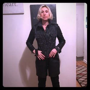 Beautiful tweed jacket with leather sleeves.